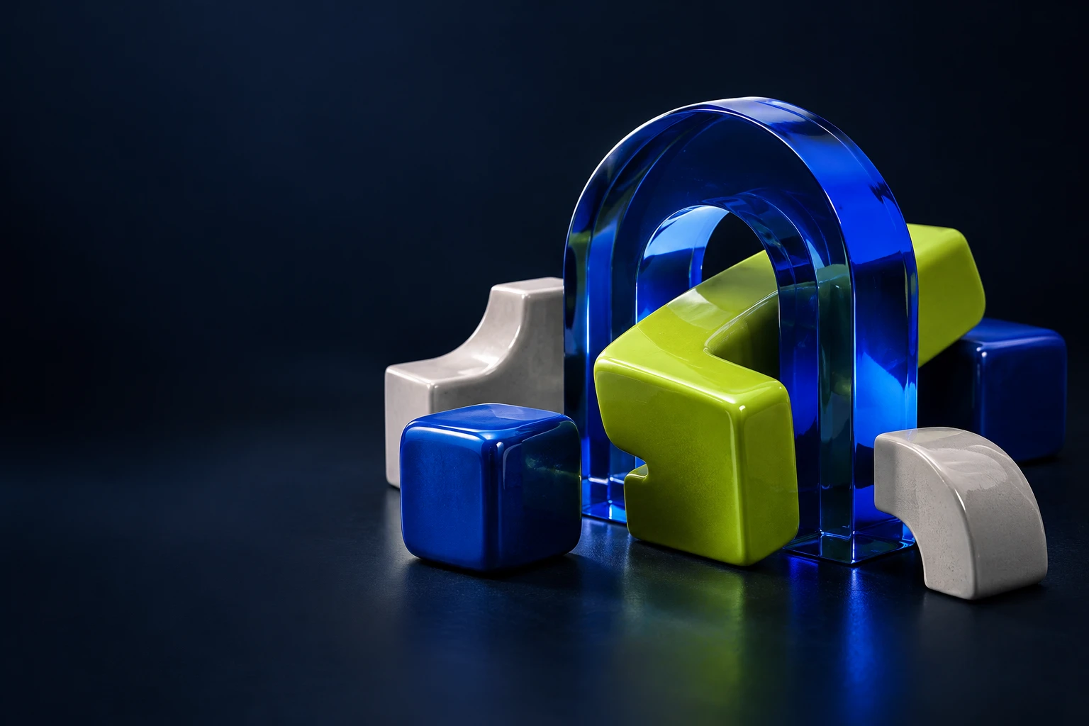 Interlocking cobalt glass and lime ceramic puzzle sculptures